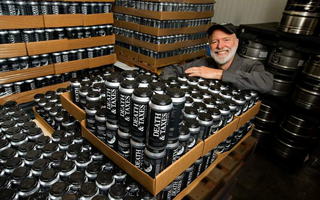 Brian Hunt of Moonlight Brewing with palettes of canned Death & Taxes