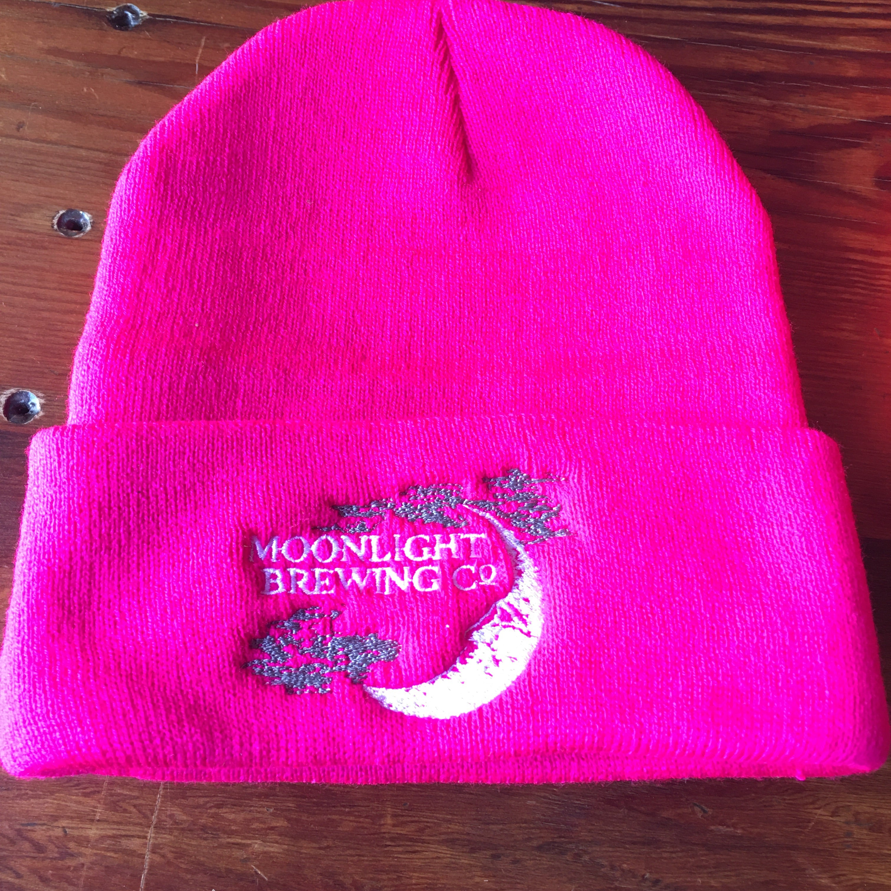 Hot pink beanie with Moonlight Brewing logo on the front